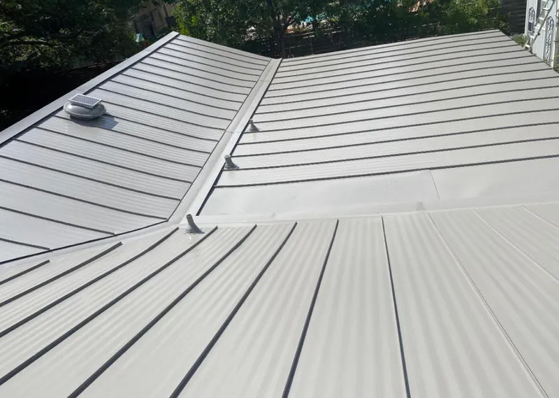 Solar attic fan installed on a metal roof for Roof Ventilation in Berlin